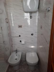 a bathroom with a toilet and a bidet at Casa Vacanze Domus Angela in Barrea +38 photos