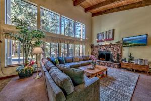 a living room with a couch and a fireplace at 121M The Meadow Drive in Stateline