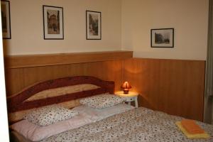 a bedroom with a bed with two pillows on it at Zderaz in Prague