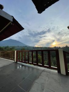 a balcony with a view of the mountains at Besakih villa in Besakih