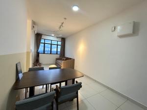 a dining room with a table and chairs at Cheras trader square traders garden park#boardgame in Kampong Bukit Dukong