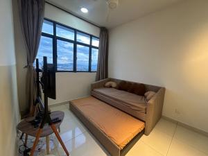 a living room with a couch and a tv at Cheras trader square traders garden park#boardgame in Kampong Bukit Dukong