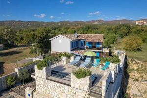 an aerial view of a house with a stone wall at Villa Lea Lana Vinodol by aneo travel in Novi Vinodolski