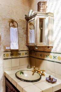 a bathroom with a sink and a mirror at Casa San Lázaro Boutique Hotel in Antigua Guatemala