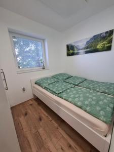 Postel nebo postele na pokoji v ubytování Apartma Pohorc - Macesen
