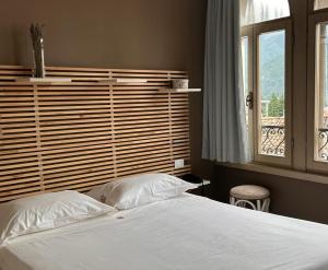 Voodi või voodid majutusasutuse Albergo Commercio - Ristorante Mas-cì toas