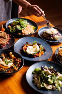 a table topped with plates of food on top at Logan Inn in New Hope
