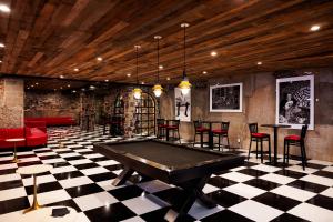 a billiard room with a pool table and chairs at Logan Inn in New Hope