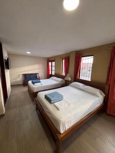 Postel nebo postele na pokoji v ubytování Hotel Casa Colonial Montufar
