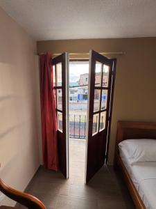 Postel nebo postele na pokoji v ubytování Hotel Casa Colonial Montufar