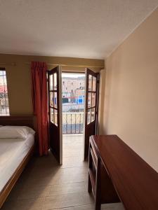 Postel nebo postele na pokoji v ubytování Hotel Casa Colonial Montufar