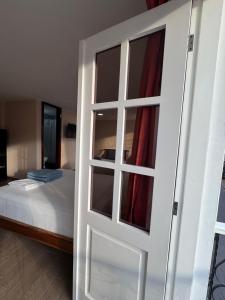 Postel nebo postele na pokoji v ubytování Hotel Casa Colonial Montufar