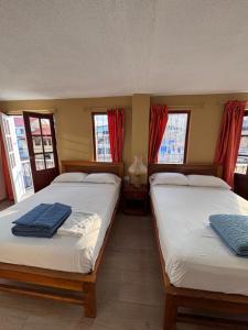 Postel nebo postele na pokoji v ubytování Hotel Casa Colonial Montufar