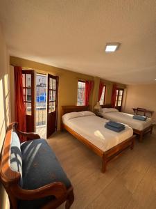 Postel nebo postele na pokoji v ubytování Hotel Casa Colonial Montufar
