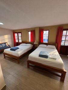 Postel nebo postele na pokoji v ubytování Hotel Casa Colonial Montufar