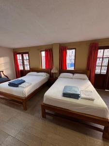Postel nebo postele na pokoji v ubytování Hotel Casa Colonial Montufar