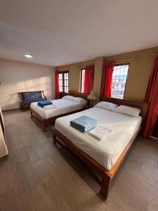 Postel nebo postele na pokoji v ubytování Hotel Casa Colonial Montufar