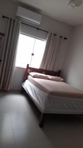 Postel nebo postele na pokoji v ubytování Casa de férias Sol Dourado