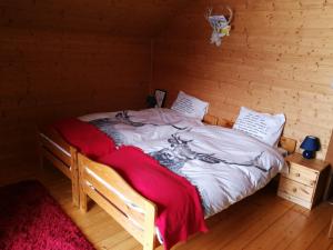Postel nebo postele na pokoji v ubytování Chalet Dreibubenhaus.