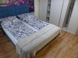 Postel nebo postele na pokoji v ubytování Apartament Kraszewskiego