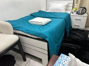 Ένα ή περισσότερα κρεβάτια σε δωμάτιο στο Abu Dhabi Phenomenal