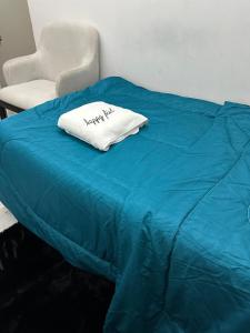 Ένα ή περισσότερα κρεβάτια σε δωμάτιο στο Abu Dhabi Phenomenal +1 φωτογραφίες