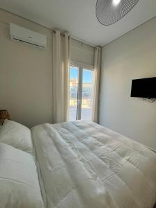Postel nebo postele na pokoji v ubytování Feels Like Home - Agrinio Suites