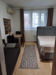 Ένα ή περισσότερα κρεβάτια σε δωμάτιο στο Fontana cozy apartment near Danube river