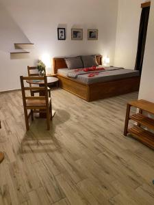 a bedroom with a bed and a table and a chair at Oasis Paje in Paje +23 photos