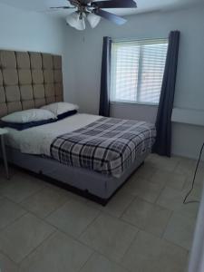 a bedroom with a bed and a ceiling fan at 2 bdrm condo Las Vegas, NV in Las Vegas