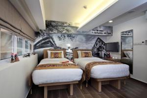 Кровать или кровати в номере Hotel Clover The Arts