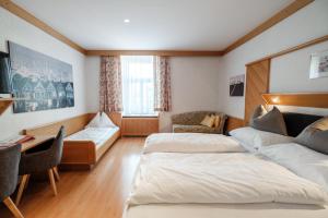 Postel nebo postele na pokoji v ubytování Hotel Restaurant Schwarzer Adler