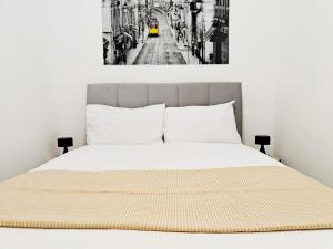 a black and white photo of a bed at Happiness in Qormi