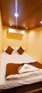 Voodi või voodid majutusasutuse Nadim Tiger Residency toas