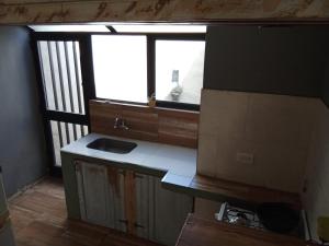 a kitchen with a sink and a window at Azul en Lavalle 6 in Azul +4 photos