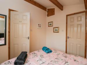 Ένα ή περισσότερα κρεβάτια σε δωμάτιο στο The Log Cabin