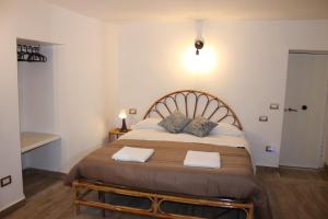 En eller flere senge i et værelse på Appartamento In Piazza