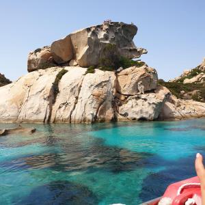a person in a boat in a body of water at Casa Nenetta in La Maddalena