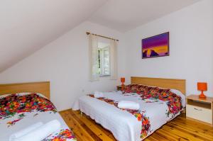 Posteľ alebo postele v izbe v ubytovaní Orka Apartments