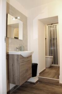 Et badeværelse på Appartamento In Piazza