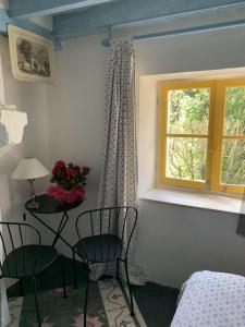 Ένα ή περισσότερα κρεβάτια σε δωμάτιο στο Chambres d'Hotes Les Renardieres