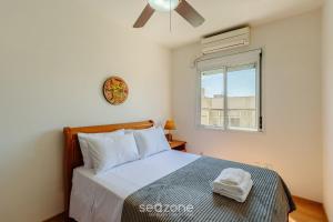 Katil atau katil-katil dalam bilik di Belo Apartamento c/ Churrasqueira em PoA RPS0460