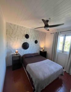a bedroom with a bed and a ceiling fan at Casita cerca de Murcia in Murcia