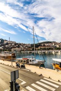 a boat is docked at a dock in the water at Urban&Veggie rooms in Dubrovnik