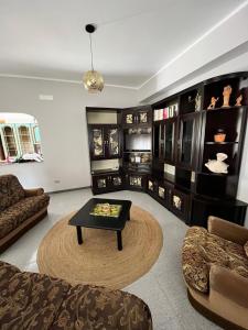 a living room with a couch and a coffee table at Villa Annette #Vivere la Puglia in Villa Castelli