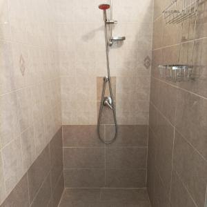 a shower with a shower head in a bathroom at Villa Annette #Vivere la Puglia in Villa Castelli