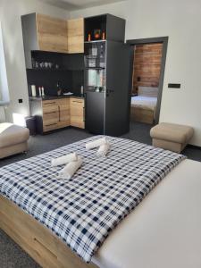 Postel nebo postele na pokoji v ubytování Apartmány Svatý Mikuláš