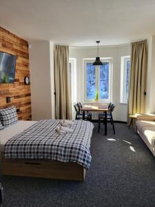 Postel nebo postele na pokoji v ubytování Apartmány Svatý Mikuláš