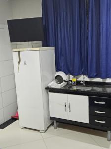 Η κουζίνα ή μικρή κουζίνα στο Loft 9 espaço inteiro térreo +5 φωτογραφίες
