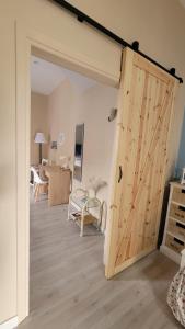 a sliding barn door in a room with a living room at Casa Relax in Nettuno